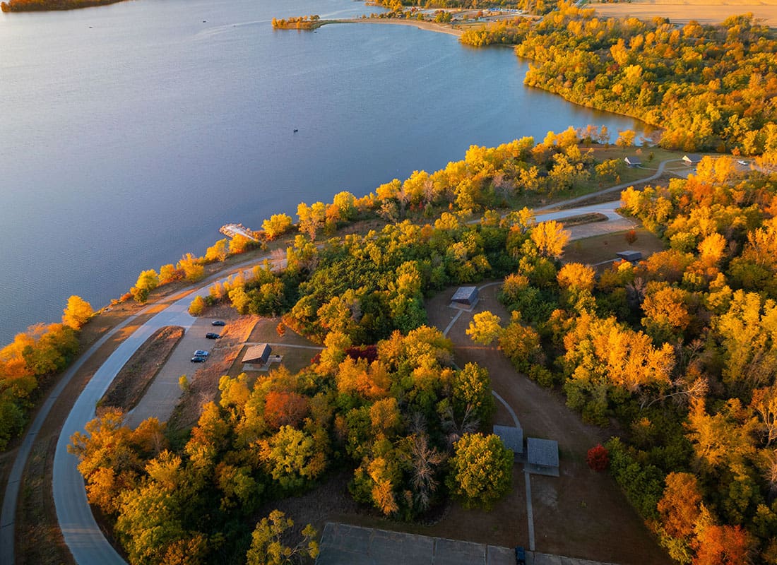 Storm Lake, IA - Aerial view of Autumn Landscape With Vibrant Foliage Surrounding Big Creek State Park
